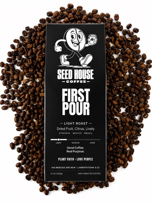First Pour bag on a bed of coffee beans